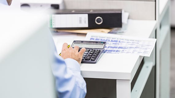 accounting professional working with a claculator